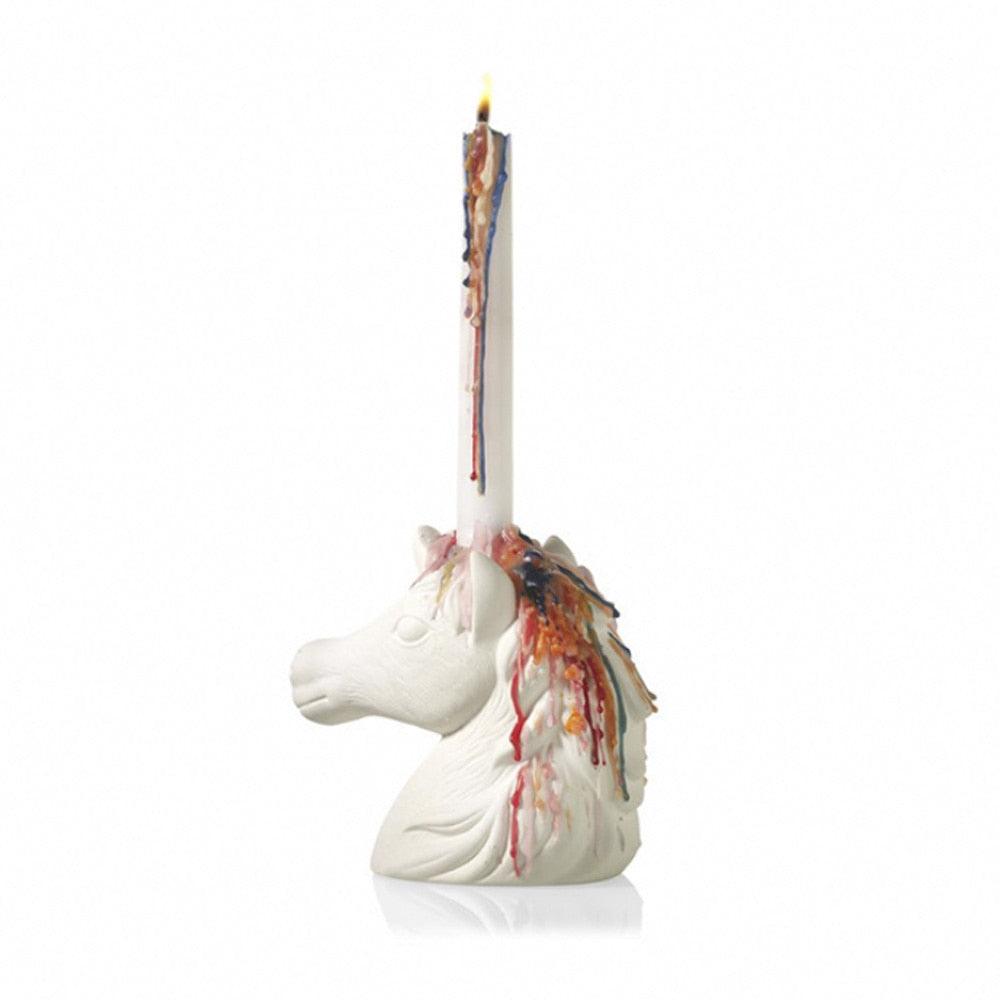 Multicolored candle with a unicorn