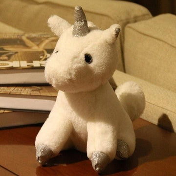 Peluche unicornio Lindo sentado - un unicornio