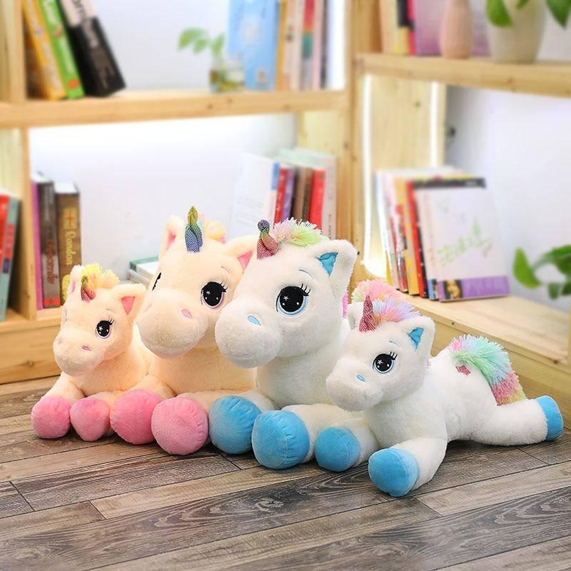 Peluche licorne arc-en-ciel rose avec ailes et corne dorée Peluche licorne arc-en-ciel rose avec ailes et corne dorée